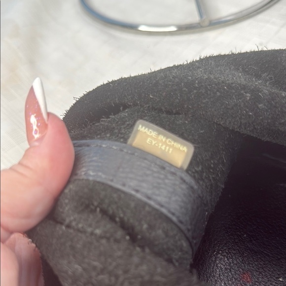 The image shows a Michael Kors Colgate Reversible Grab Bag in black. - Picture 8 of 11